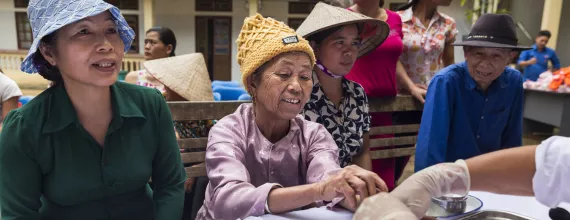 Patients getting screened in a community health camp in Vietnam