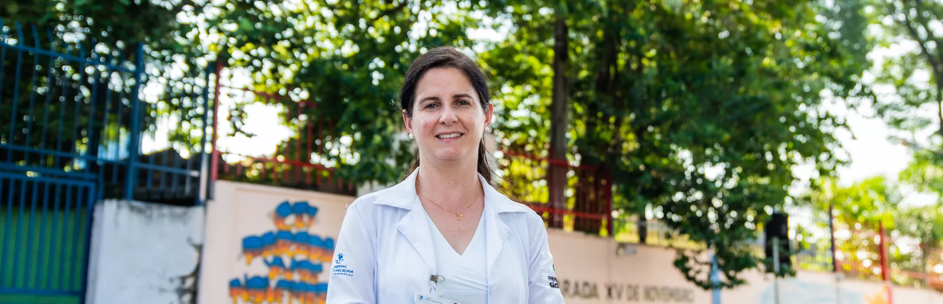 A Brazilian physician working in the field of cardiovascular disease is standing on a street in São Paulo