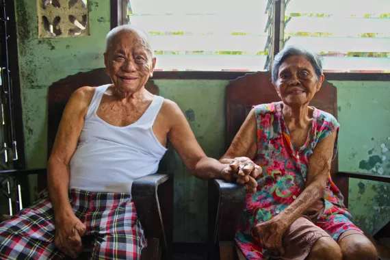 Elderly Philipines couple, leprosy patients Elderly leprosy patients couple in Philippines holding hands