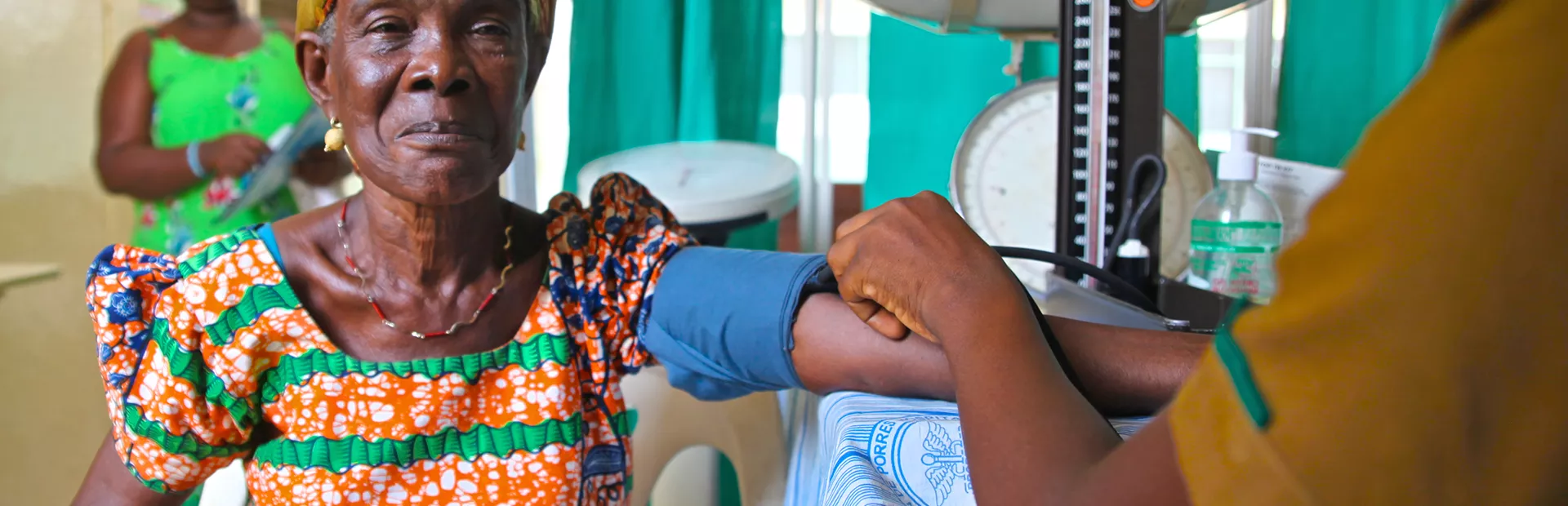 Image of female patient getting blood pressure measured