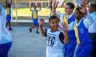 KaziBantu program: children in South Africa learning about cardio health and doing physical exercises outside of the school