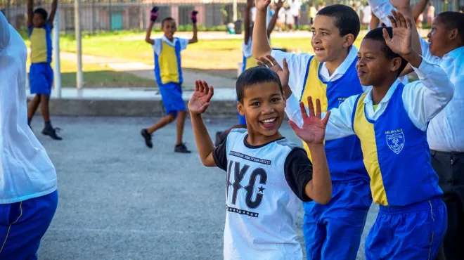 KaziBantu program: children in South Africa learning about cardio health and doing physical exercises outside of the school