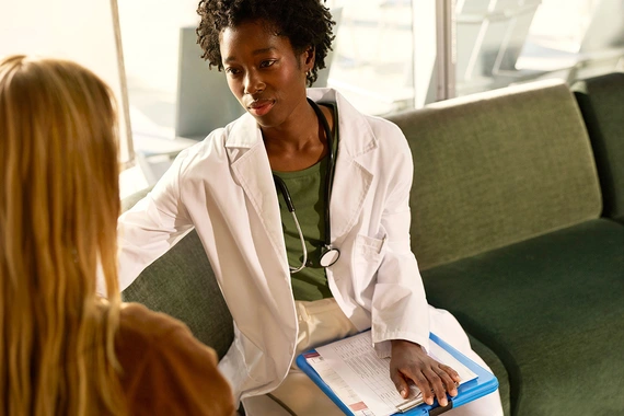 doctor consulting with patient at healthcare clinic