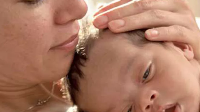 Mother with a Baby lying on her chest