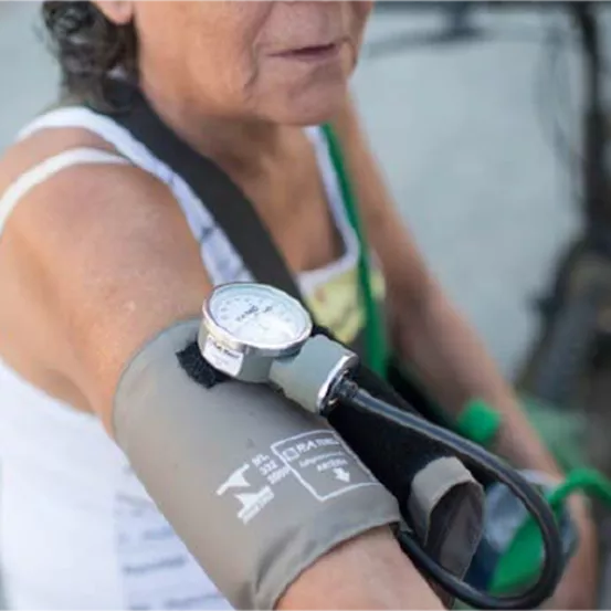 Middle aged woman with blood pressure monitor