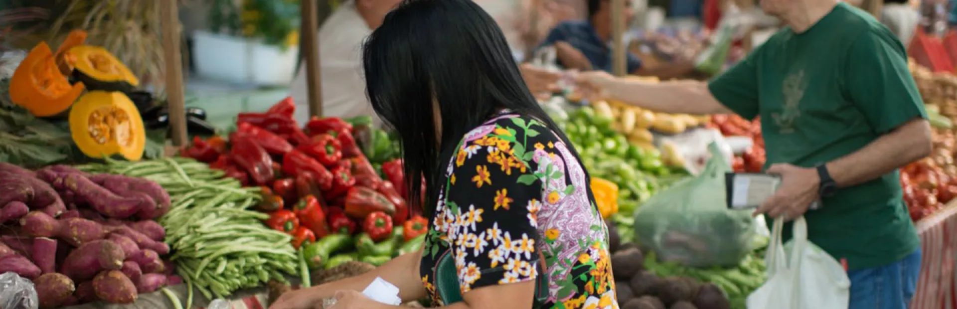 Woman buying vegetables on a market in Brazil