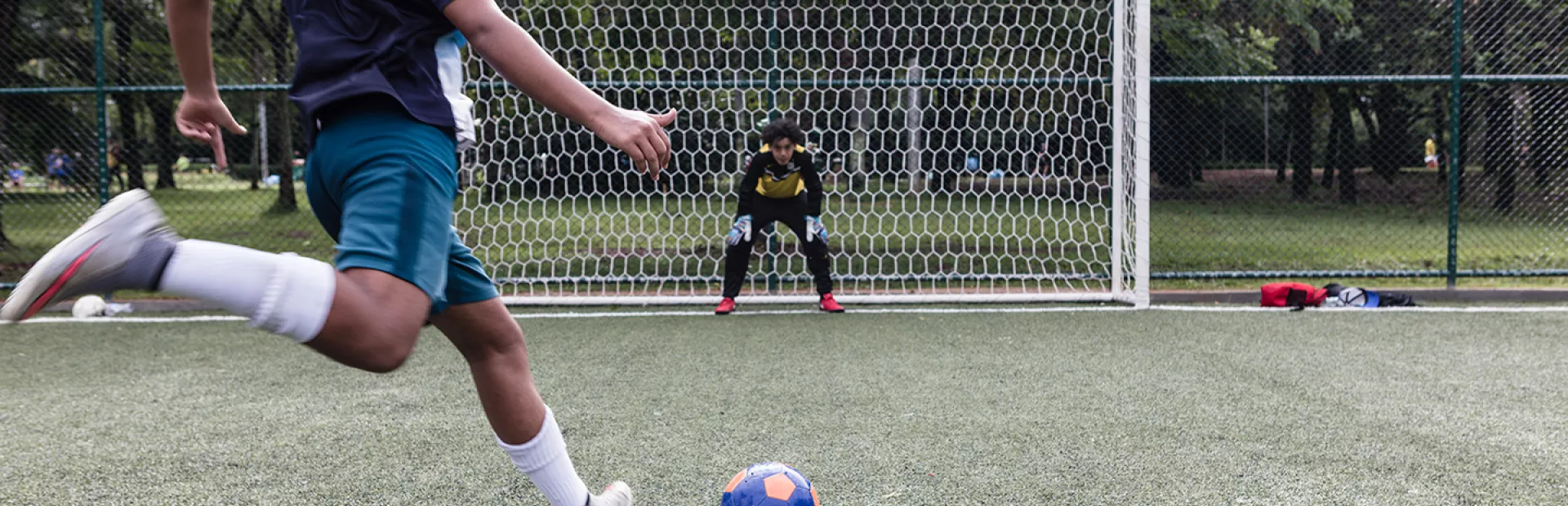 two children playing soccer_0