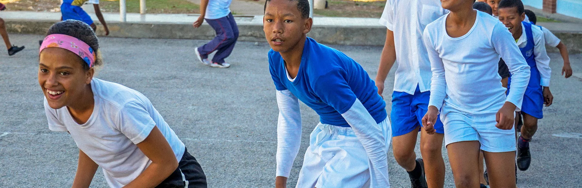 Kids doing exercise outside at school, addressing heart health in disadvantaged schools in South Africa